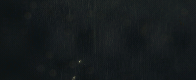 Woman In Bat Suit Standing In Rain GIF