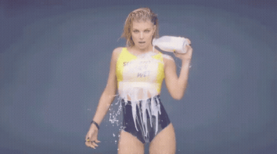 Woman In Bathing Suit Holding Milk GIF