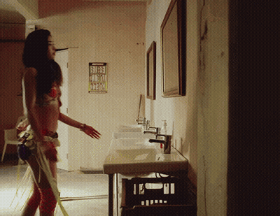 Woman In Bathing Suit In Bathroom With Busy Sign GIF