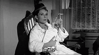 Woman In Bathrobe Rocking With Water And Paper GIF