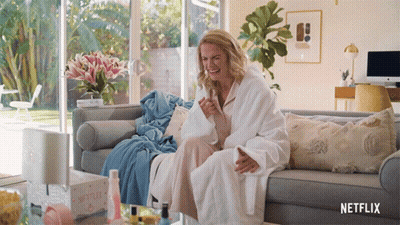 Woman In Bathrobe Sitting On Couch Netflix GIF