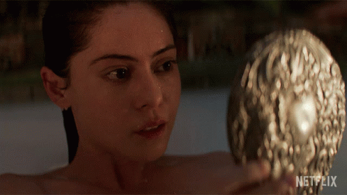 Woman In Bathtub Looking At Herself In Mirror With Netflix Logo GIF