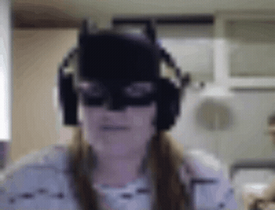 Woman In Batman Mask And Headphones Making Funny Face GIF