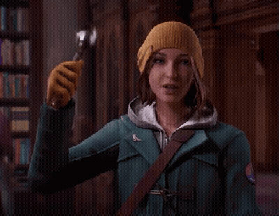 Woman In Beanie Holding Spoon GIF