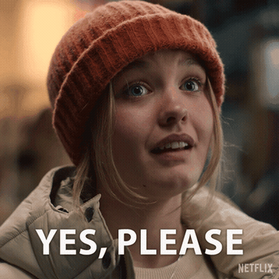 Woman In Beanie Saying Yes Please GIF