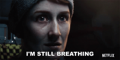 Woman In Beanie Says I'm Still Breathing Netflix Ad GIF