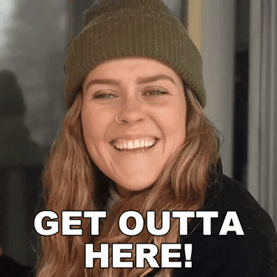 Woman in Beanie Smiling Get Outta Here