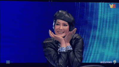 Woman In Beret And Headphones Smiling On TV GIF