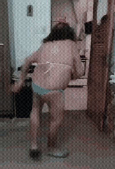 Woman In Bikini Dancing In Kitchen GIF