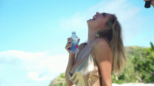 Woman In Bikini Holding Water Bottle GIF