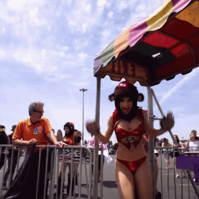 Woman In Bikini In Front Of Colorful Canopy GIF