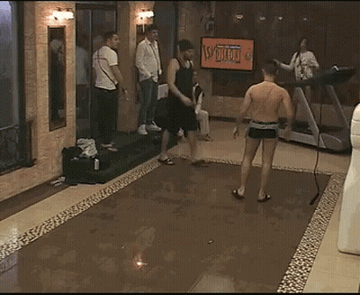 Woman In Bikini Laying On Floor With Treadmill And People GIF