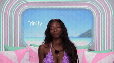 Woman In Bikini Sitting By Window With Trinity GIF