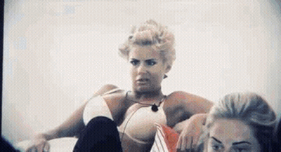 Woman In Bikini Sitting Legs Crossed Another Watching GIF