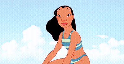 Woman In Bikini Sitting On Beach GIF