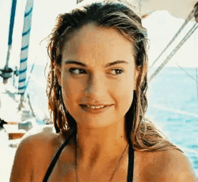 Woman In Bikini Sitting On Boat GIF