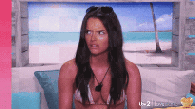 Woman In Bikini Sitting On Couch With ITV 2 Love Island GIF