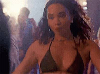 Woman In Bikini Top Dancing In Club GIF