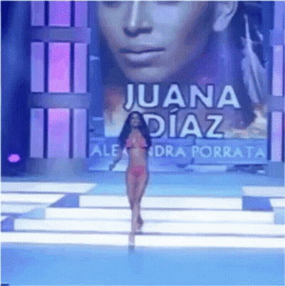 Woman In Bikini Walking Runway With Juana Diaz Background GIF