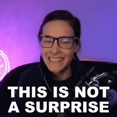 Woman In Black Adidas Hoodie And Hoop Earrings Looking At Camera GIF