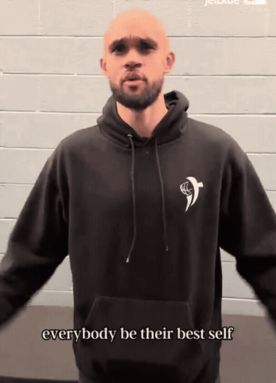 Woman In Black Adidas Sweater And Hat Pointing GIF