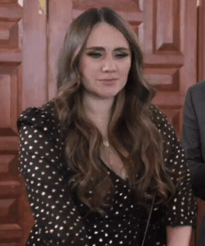 Woman In Black And Gold Polka Dot Dress GIF