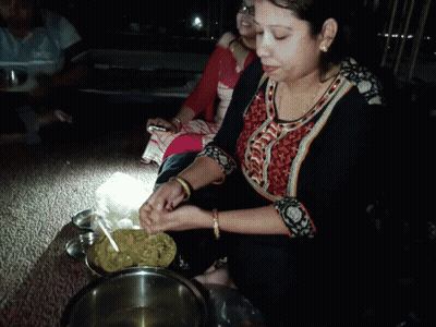 Woman In Black And Orange Shirt Cooking In Bowl GIF