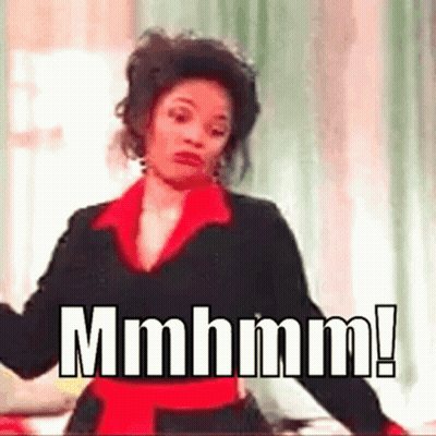 Woman In Black And Red Dress Making Funny Face GIF