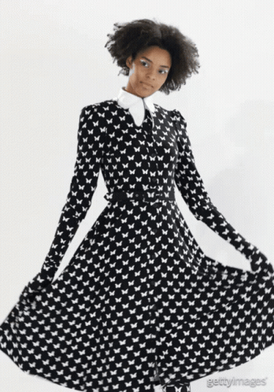 Woman In Black And White Butterfly Dress GIF