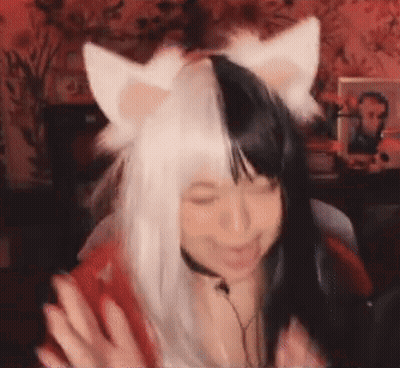 Woman In Black And White Cat Ears Wig At Microphone GIF