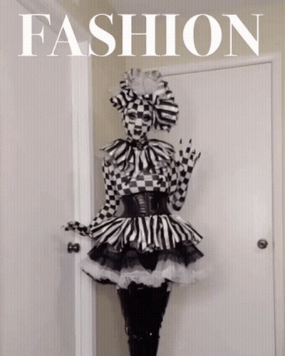 Woman In Black And White Checkered Dress With Fashion Sign GIF