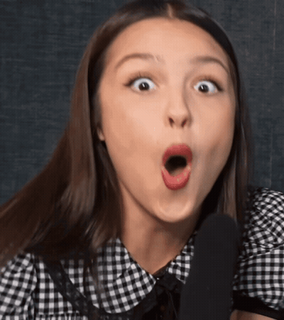 Woman In Black And White Checkered Shirt Surprised GIF