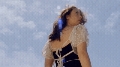 Woman In Black And White Dress Blue Sky GIF