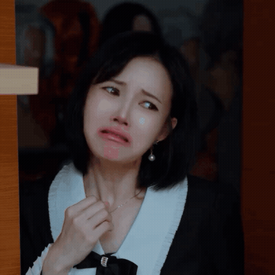 Woman In Black And White Dress Making Face GIF