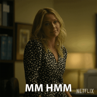 Woman In Black And White Dress Says Mmhmm Netflix Advertisement GIF