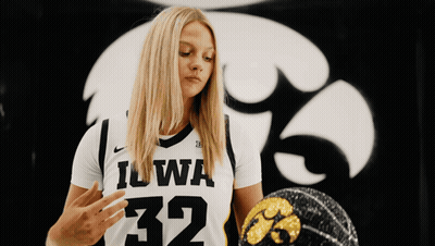 Woman In Black And White Iowa Jersey Holding Basketball GIF