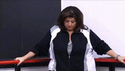 Woman In Black And White Jacket Next To Bar GIF