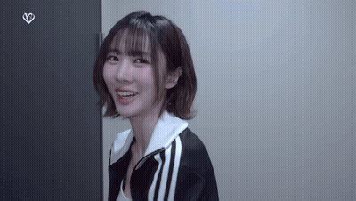 Woman In Black And White Jacket Smiling GIF