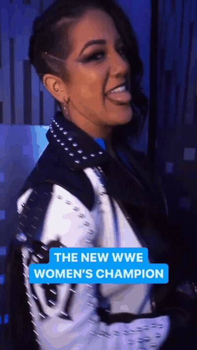 Woman In Black And White Jacket Smiling The New WWE Women's Champion GIF