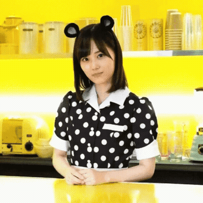 Woman In Black And White Polka Dot Dress With Mouse Ears GIF
