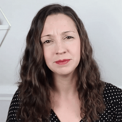 Woman In Black And White Polka Dot Shirt Making Funny Face GIF
