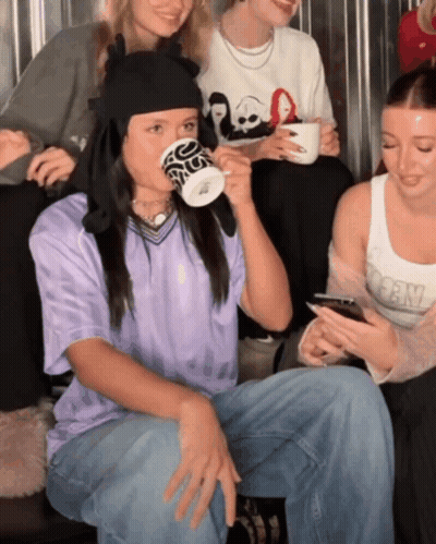 Woman In Black And White Store With Sofia Sign GIF