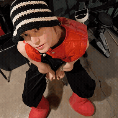 Woman In Black And White Striped Hat GIF