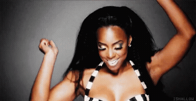 Woman In Black And White Striped Top Dancing With Arms Up GIF