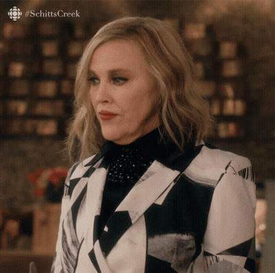 Woman In Black And White Suit Schitts Creek GIF