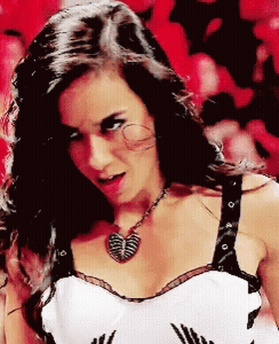 Woman In Black And White Top With Butterfly Necklace GIF