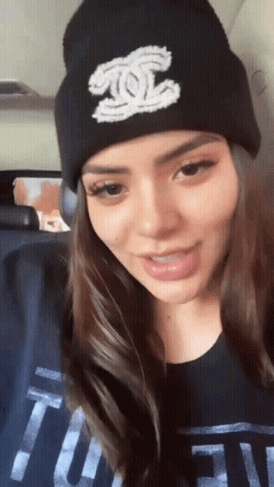 Woman In Black Beanie And Tufn T-Shirt GIF
