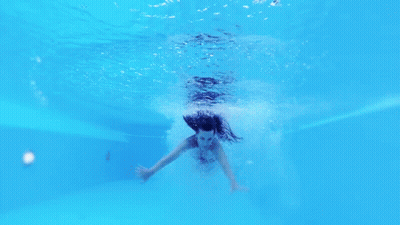 Woman In Black Bikini Swimming GIF