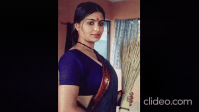 Woman In Black Blouse Holding Breasts GIF