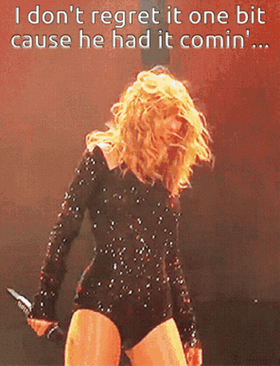 Woman In Black Bodysuit Holding Microphone Says I Don't Regret It GIF